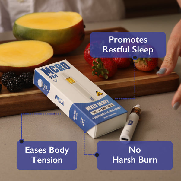 Mixed Berry Indica Disposable Vape - 1 Gram THCA and CBN - Product Laying Near Fruit Flavors - MCRO Edibles in the U.S.