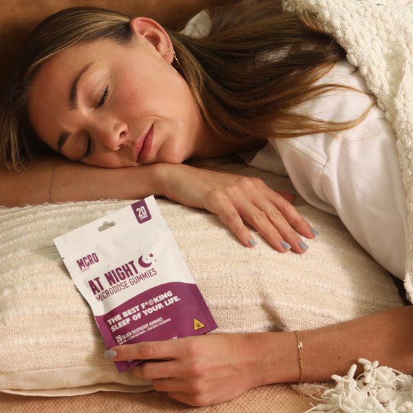 Bedtime Routine Gummy - At Night Blend for Restful Sleep - Woman Sleeping with Gummies in Hand - MCRO Edibles in the U.S.